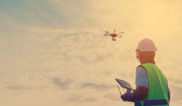 Engineer inspect and checking solar panel by Drone at solar power plant